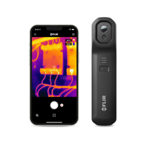The FLIR one Edge Pro sitting next to an Iphone. The One Edge Pro can clip onto the phone and operates through Bluetooth to send live thermal imaging to your phone through the FLIR app.